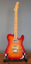 A 1989 Schecter telecaster electric guitar, Made in USA, serial number 890257, finished in Sienna