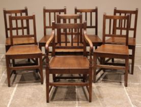 A matched set of eight oak country chairs, early 19th century, each chair with a lath back over a