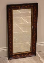 A 19th century Dutch walnut and marquetry inlaid wall mirror, the moulded rectangular frame inlaid