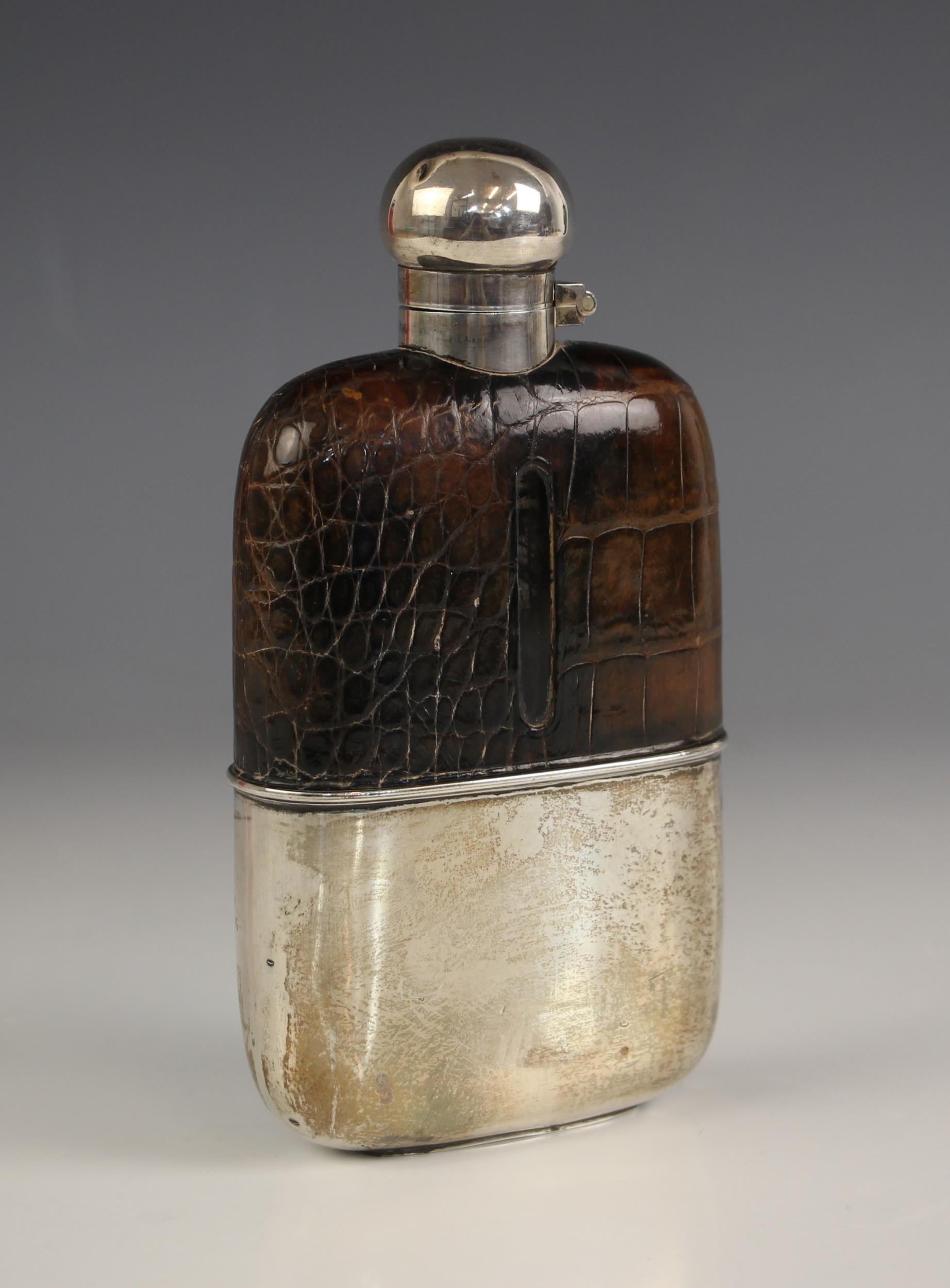 An Edwardian silver hipflask, G and J W Hawksley, Sheffield 1903, the bayonet hinged cover above