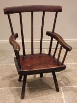 A primitive stained ash comb back chair, probably West Country, late 18th/early 19th century, the