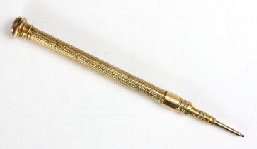 A 20th century gold plated propelling pencil, with engine turned detail and banded hardstone