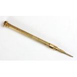 A 20th century gold plated propelling pencil, with engine turned detail and banded hardstone