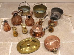 A selection of copper and brass wares, 19th century and later, to include a Victorian saucepan lid