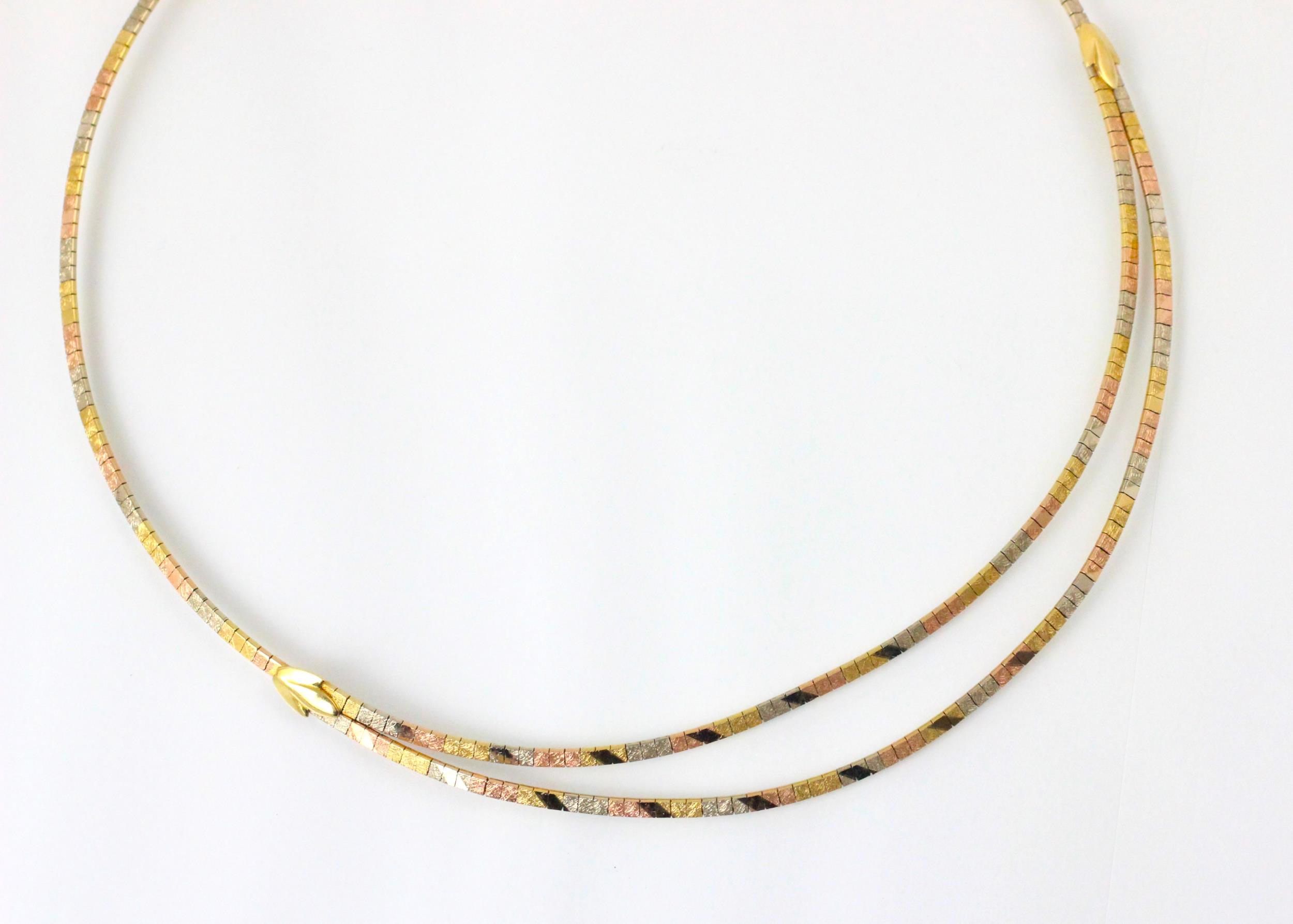 A tri-coloured yellow metal necklace, the central double strand designed as square flat links - Image 3 of 3