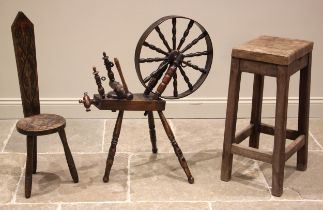 A Welsh spinning wheel, probably fruit wood, 19th century, the twelve spindle wheel upon three