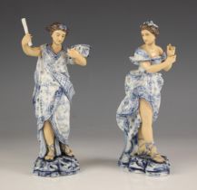 A pair of Sitzendorf porcelain figures, early 20th century, modelled as Grecian women stood before
