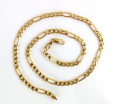 A yellow metal figaro style chain, with elongated rectangular links and lobster fastening,