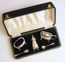 A cased silver condiment set, Joseph Gloster Ltd, Birmingham 1956, comprising wet mustard, open