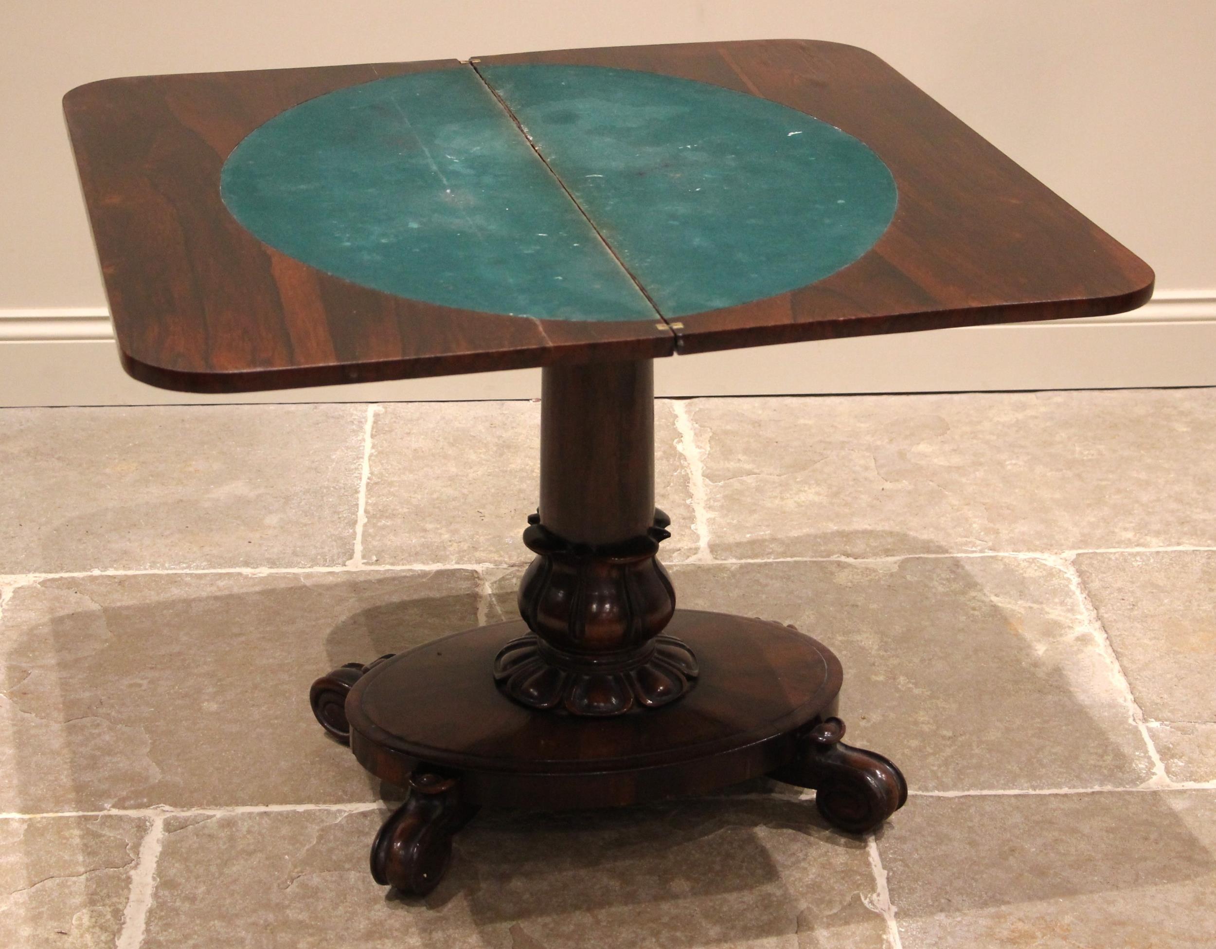 A William IV rosewood pedestal card table, the rectangular folding top opening to a circular baize - Image 2 of 2