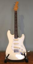 A 1988 Fender Stratocaster electric guitar, serial number E718578, Olympic white finish, made in