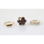 A selection of jewellery, including an untested garnet and 9ct yellow gold dress ring, ring size