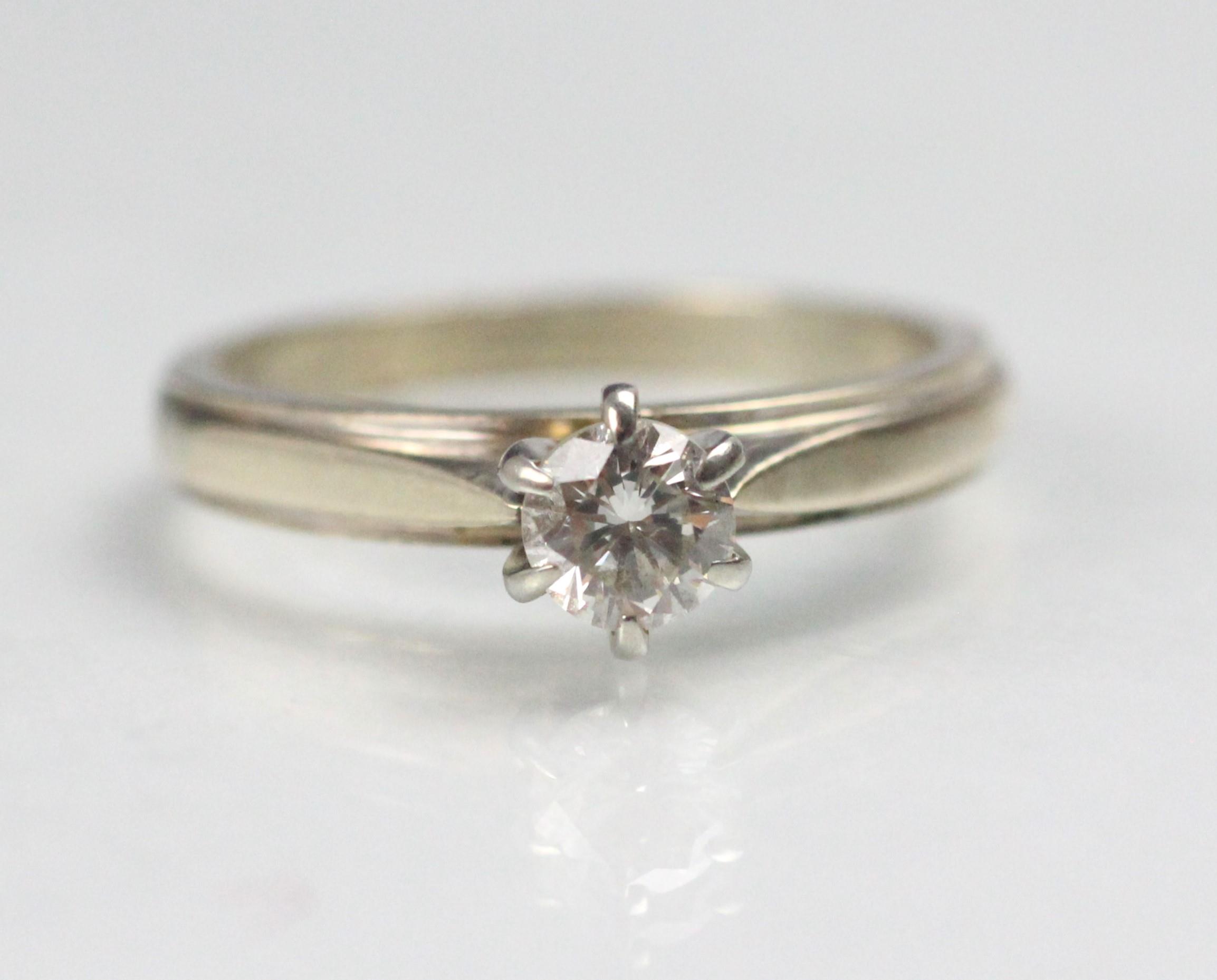 A certified diamond solitaire ring, the central round cut diamond claw set in raised mount, upon - Image 5 of 5