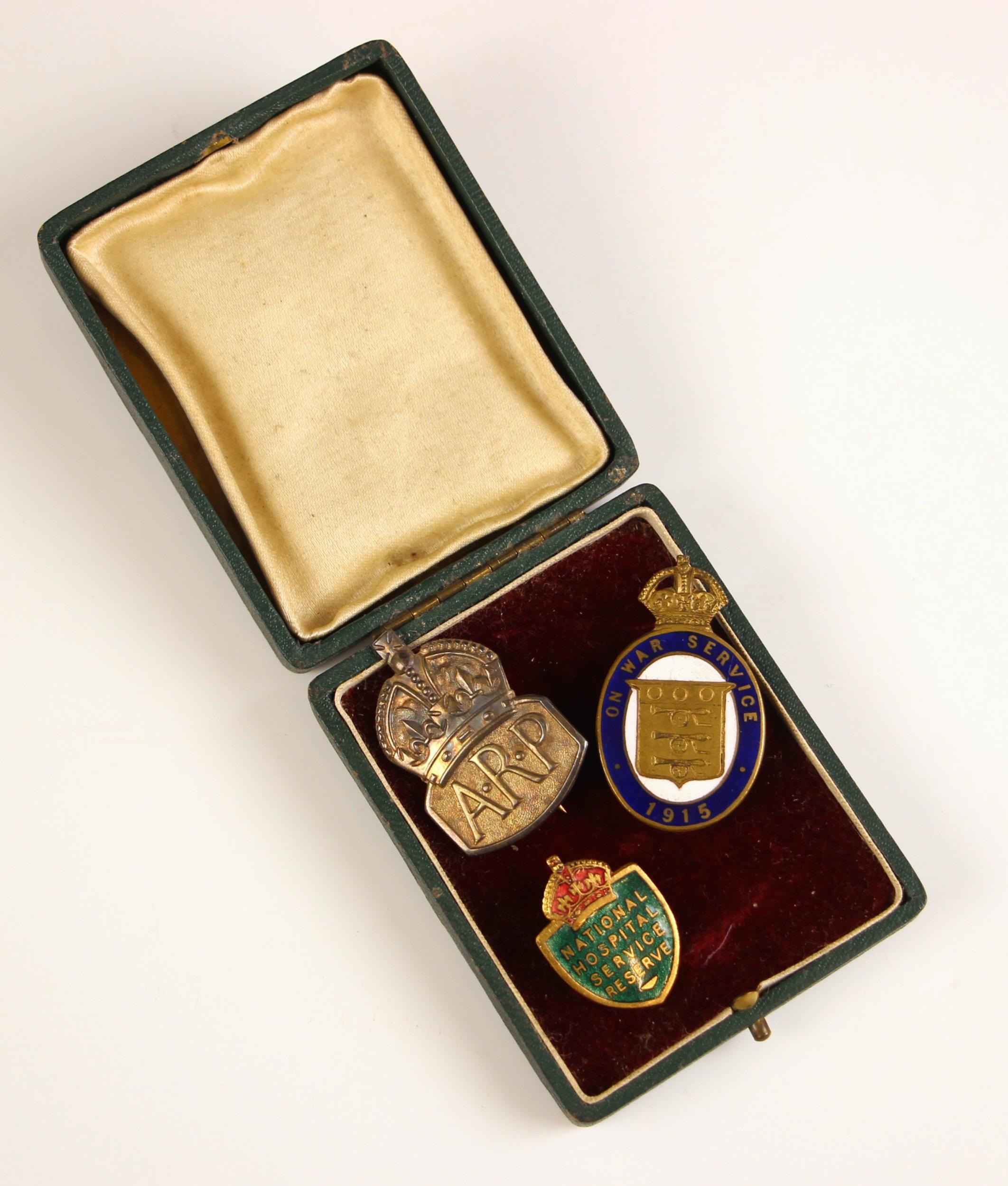 WORLD WAR I AND II INTEREST: A silver Air Raid Patrol ARP lapel badge, 3.8cm high, with an 'One