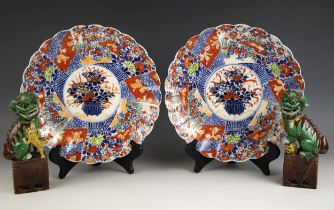 A pair of Chinese porcelain Sancai glazed Dogs of Fo, 19th century, each modelled standing upon an