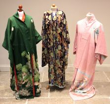 A collection of five Japanese printed silk and cotton Kimonos, 20th century, each printed in a