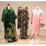 A collection of five Japanese printed silk and cotton Kimonos, 20th century, each printed in a