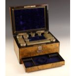 A burr walnut lady's dressing vanity case, 19th century, the hinged cover with vacant mother of