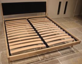 A Heals Gazzda 'Fawn' bed, comprising a black cotton woven headboard, 135cm wide, two side rails
