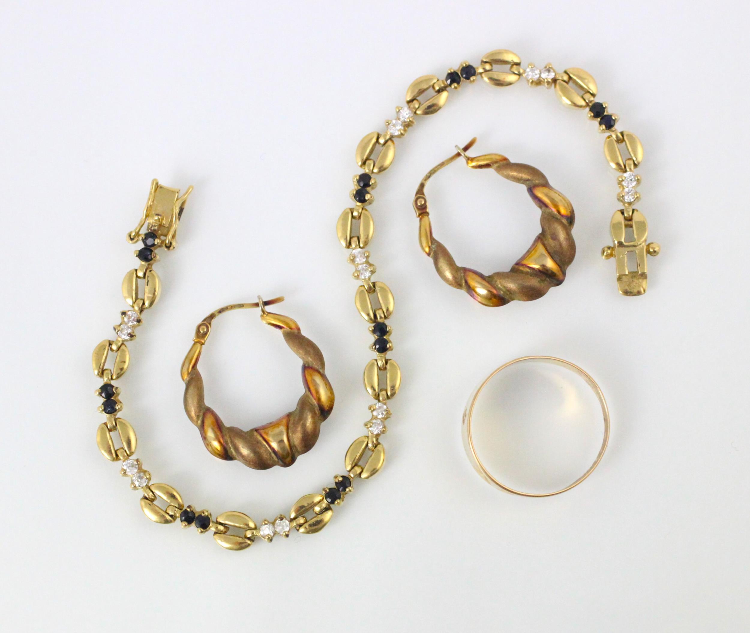 A selection of jewellery, including a pair of yellow metal hoop style earrings, with plain