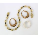 A selection of jewellery, including a pair of yellow metal hoop style earrings, with plain