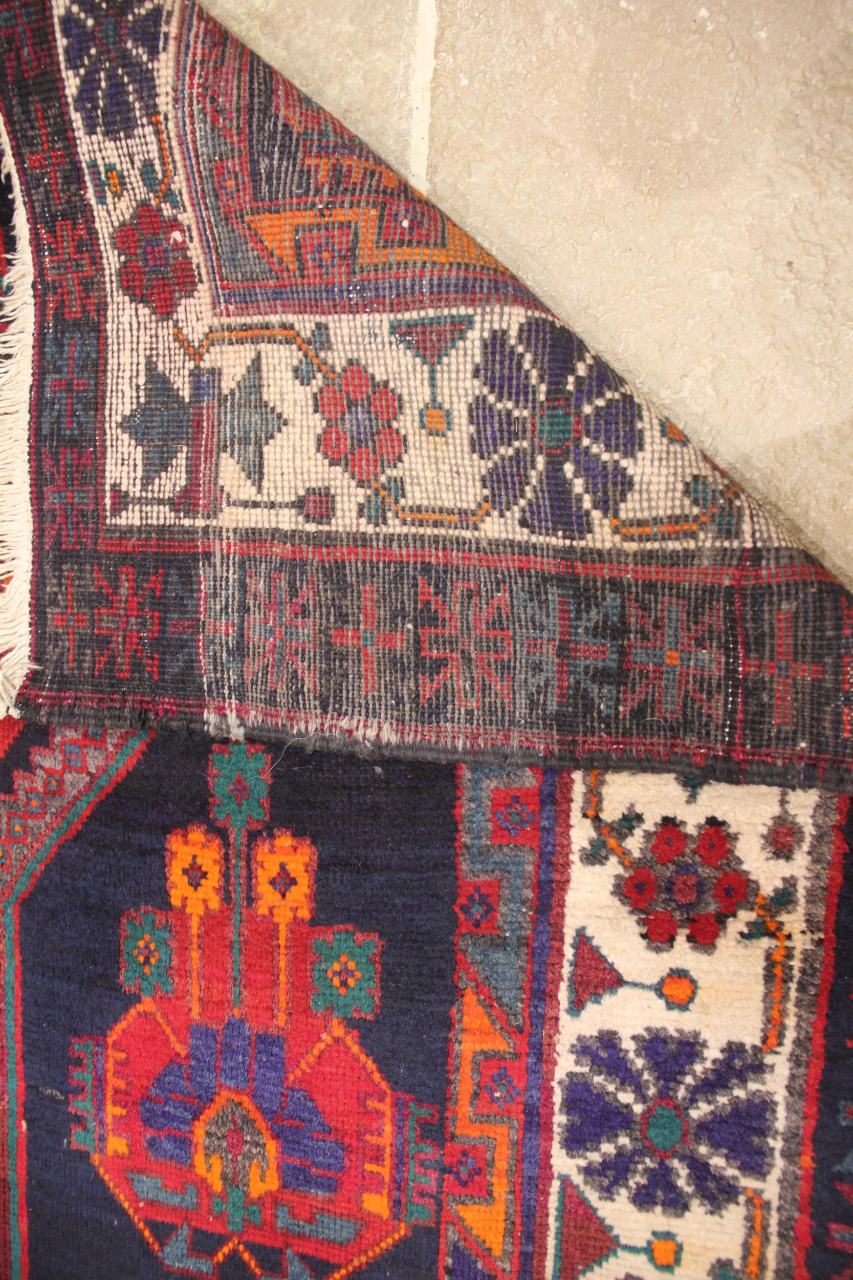 A vintage Persian Nahavan rug, bespoke design, rich colourways of blue, red orange and green, the - Image 2 of 2