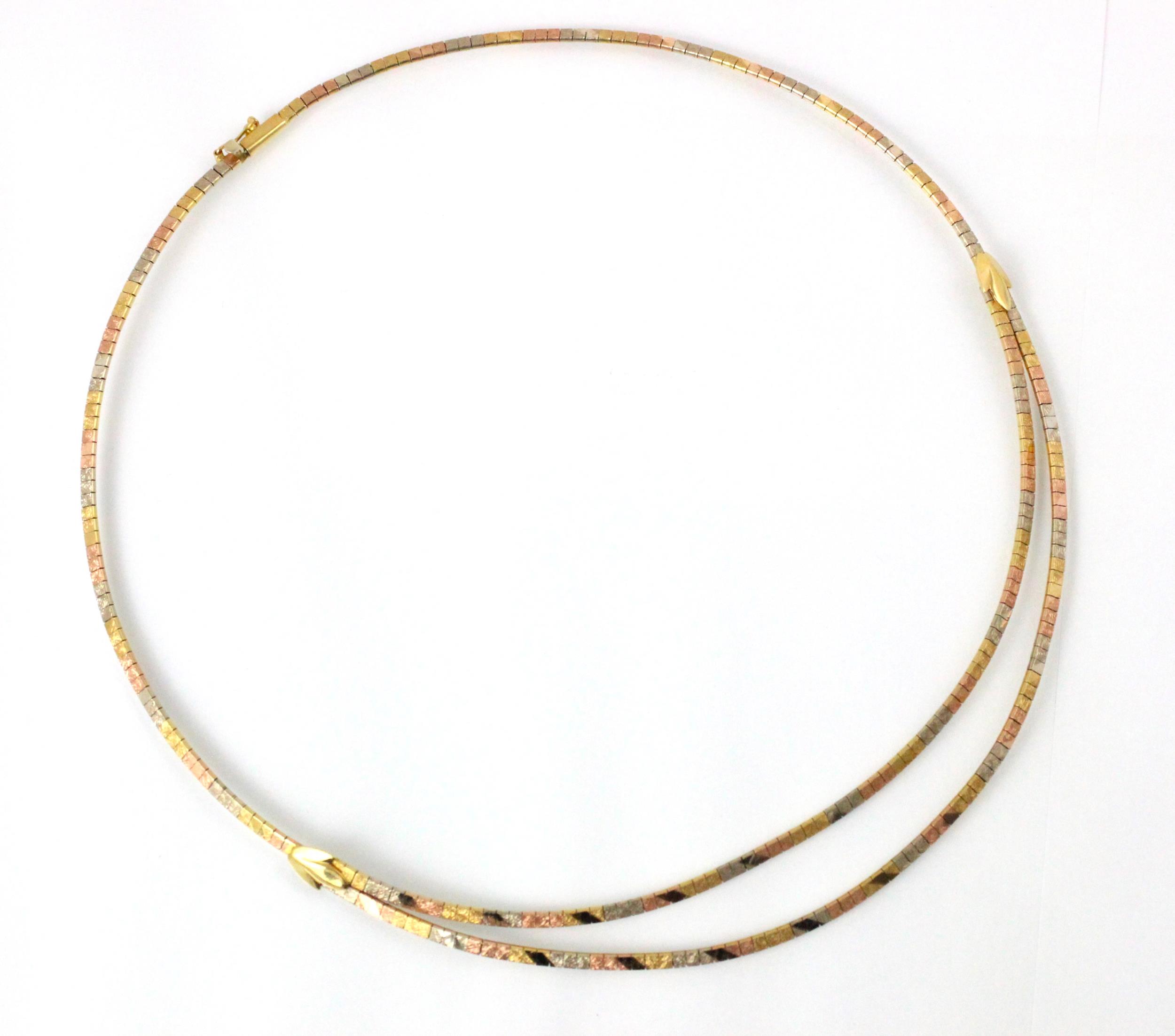 A tri-coloured yellow metal necklace, the central double strand designed as square flat links