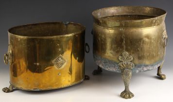 A brass coal or log bucket, 19th century, raised on three cabriole legs with paw feet, 36cm high,