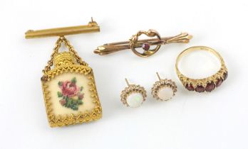 A selection of jewellery, including a 9ct yellow gold untested garnet set ring, in Victorian