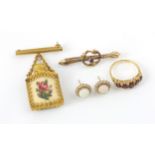 A selection of jewellery, including a 9ct yellow gold untested garnet set ring, in Victorian