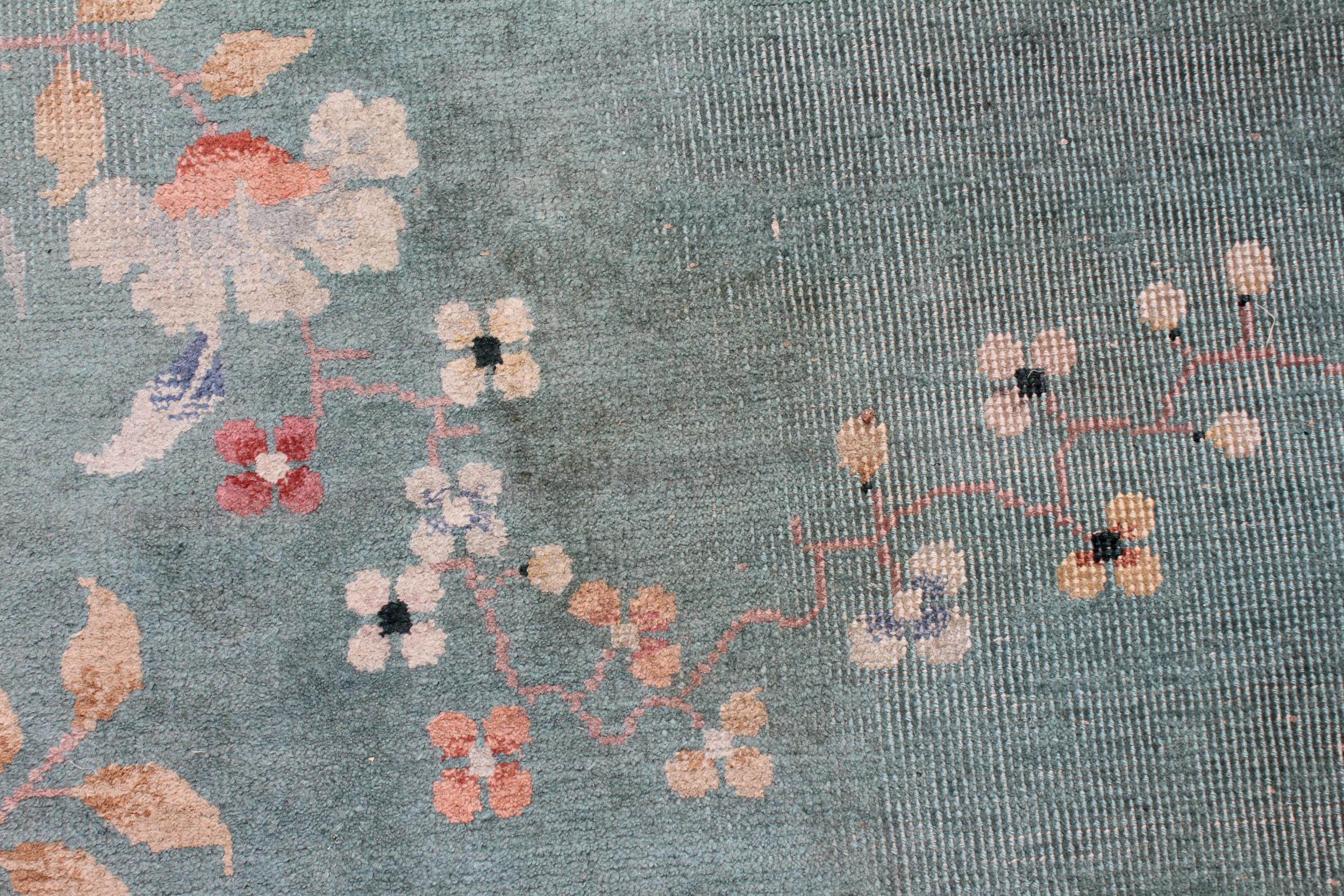 A large Chinese wool carpet, early 20th century, with floral motifs against a duck egg blue - Image 6 of 7