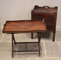 A George III mahogany tray top bedside chest, the galleried top over a pair of cupboard doors and