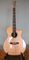 A 2009 Martin GPCP1A Aura electrics acoustic guitar, made in USA, serial number 1403205, within