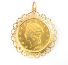 A yellow metal mounted USA $20 coin, dated 1904, within openwork yellow metal pendant mount, 6cm