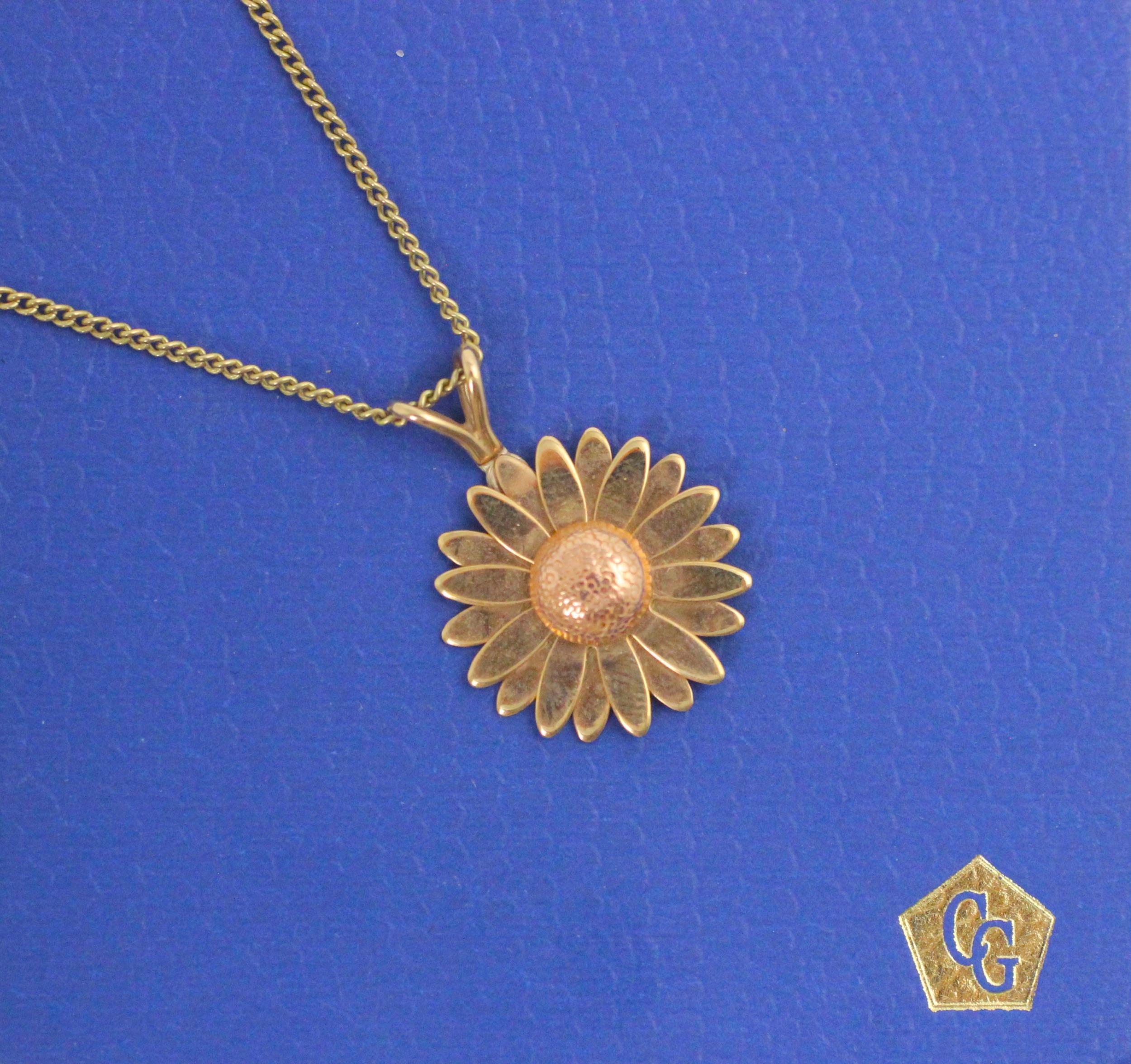 A Clogau 9ct gold ‘sunflower’ pendant, with realistic engraved detail, stamped to reverse, upon