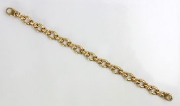 A 9ct yellow gold bracelet, the circular links with stylised star detail, stamped with import