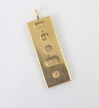 A 9ct yellow gold ingot pendant, the rectangular ingot stamped ‘OMC’ Sheffield 1977, 31gms