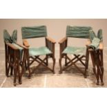 Four stained beech wood folding director's chairs, 20th century, of slatted form upon a folding '