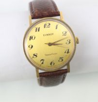 A yellow metal cased Tissot SeaStar Seven wristwatch, the gold coloured dial with Arabic numerals,