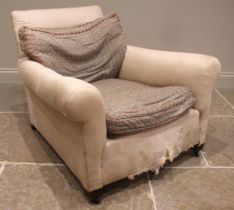 A Victorian armchair, in the manner of Howard & Sons, of typical deep seated form, long padded