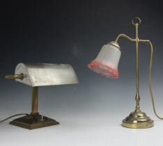 A Edwardian lacquered brass banker's type desk lamp, early 20th century, on pyramidal base with