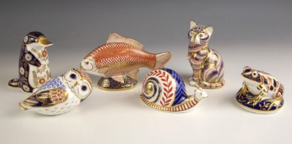 Four Royal Crown Derby paperweights, comprising: a platypus, 12cm high, a fish, 17cm long, a cat,