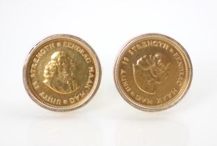 A pair of yellow metal mounted 1 rand coin cufflinks, the coins mounted in plain polished mount with