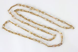 A yellow metal necklace, the fancy link chain with triple spherical detail, stamped to lobster clasp