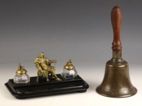 A brass and slate figural desk tidy, late 19th century, the central brass figure of a seated