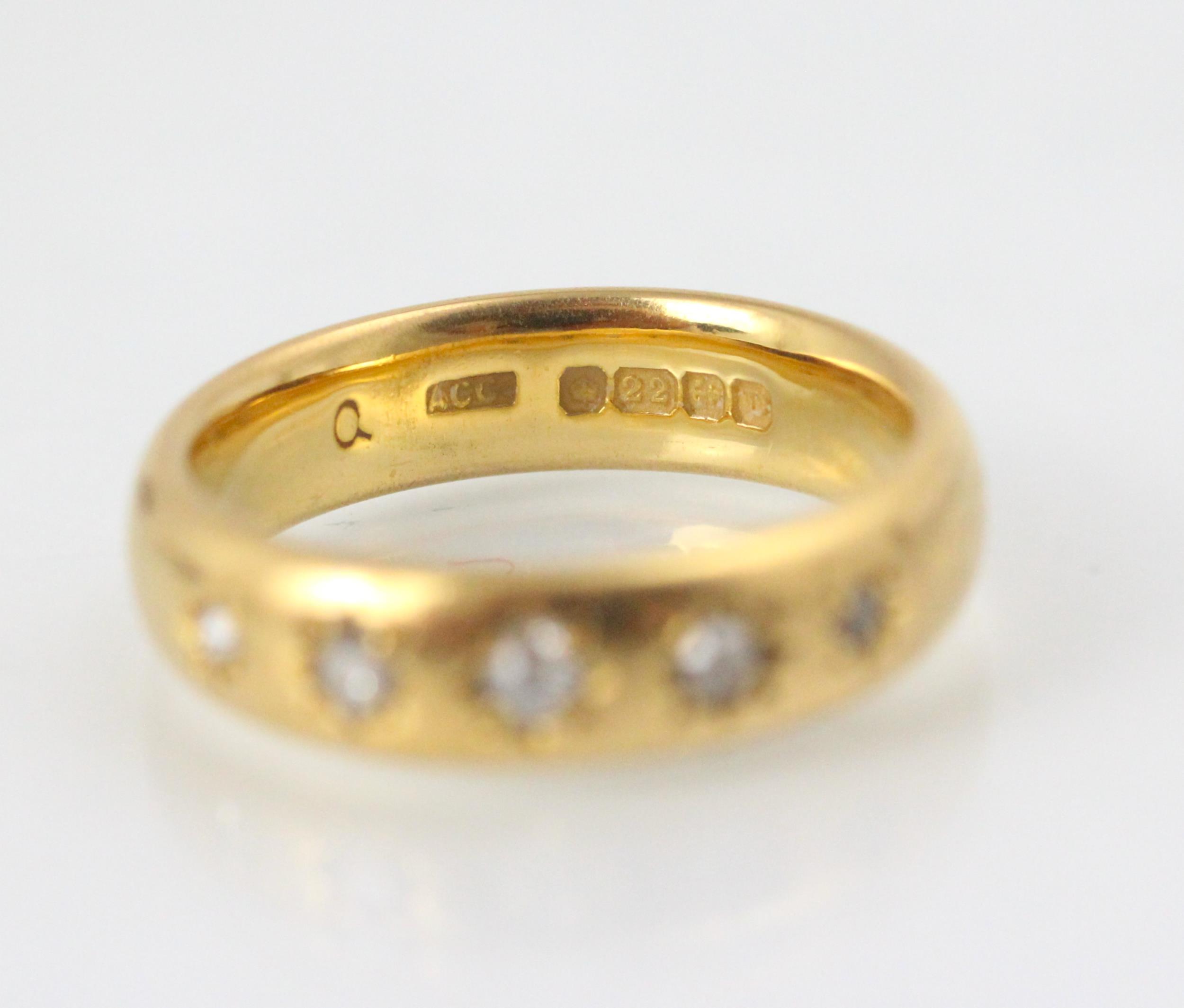 A 22ct yellow gold diamond set ring, the five graduated old cut diamonds later set into a 22ct - Image 2 of 2