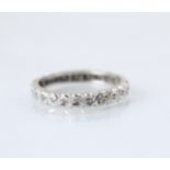A diamond set full eternity ring, the continuous round cut diamonds within white metal shank, open