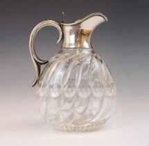 A Victorian silver collared claret jug, John Grinsell and Sons, London 1897, the scroll handle above