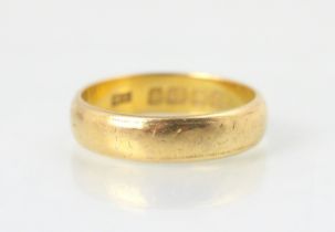 A 22ct yellow gold wedding band, stamped ‘HA’ Birmingham 1912, ring size P, 5.6gms