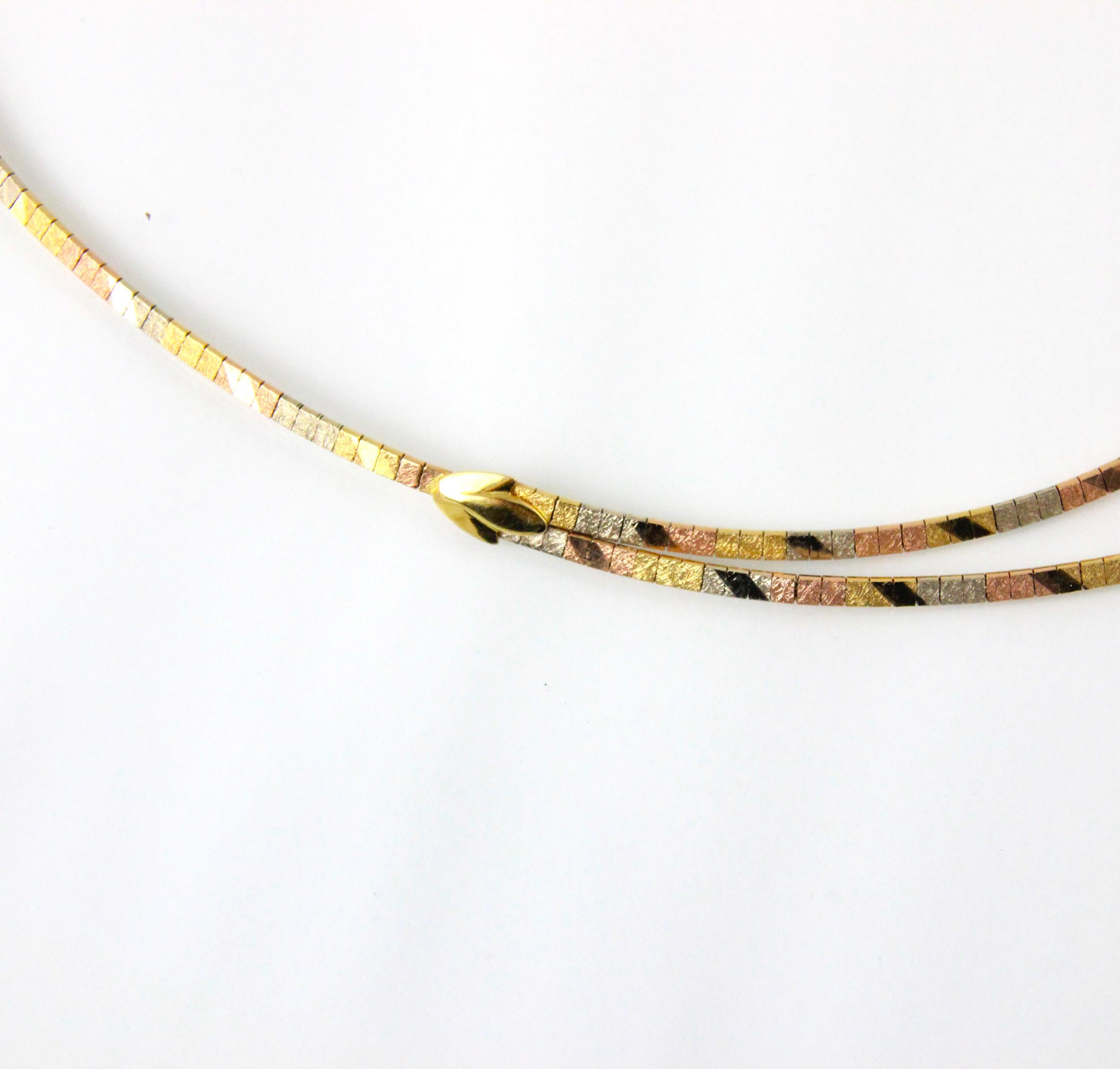 A tri-coloured yellow metal necklace, the central double strand designed as square flat links - Image 2 of 3